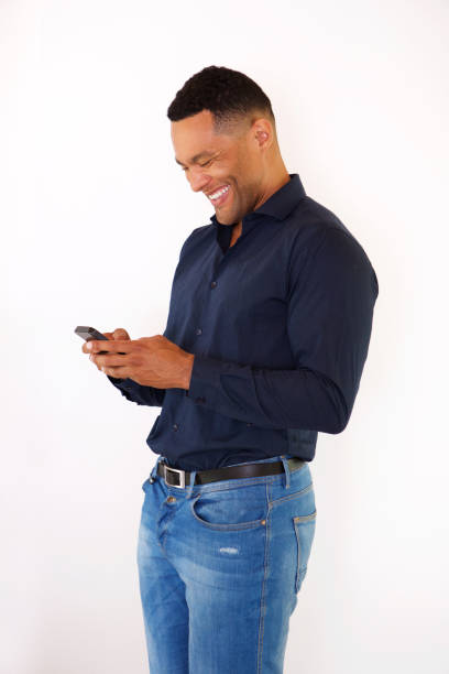 istock African american man sending text message from smart phone 905883646
