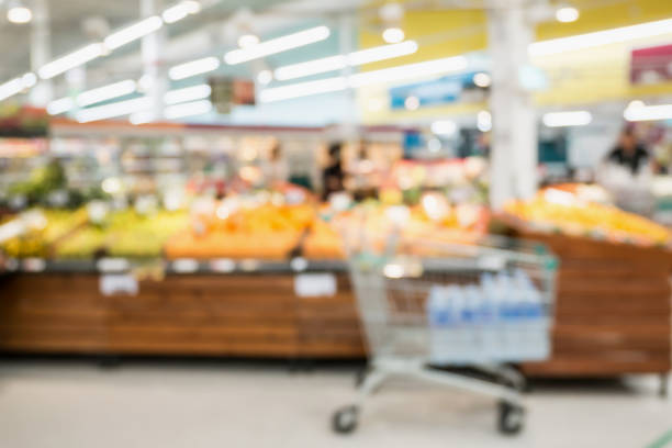 istock Supermarket grocery store with fruit and vegetable on shelves blurred background 905884476