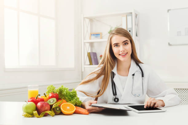 istock Female nutritionist working on digital tablet 905884942