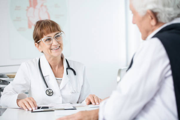 istock Doctor smiling at patient 905889678