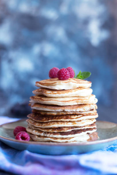 istock Pancakes with berries and honey. Copy space 905893944