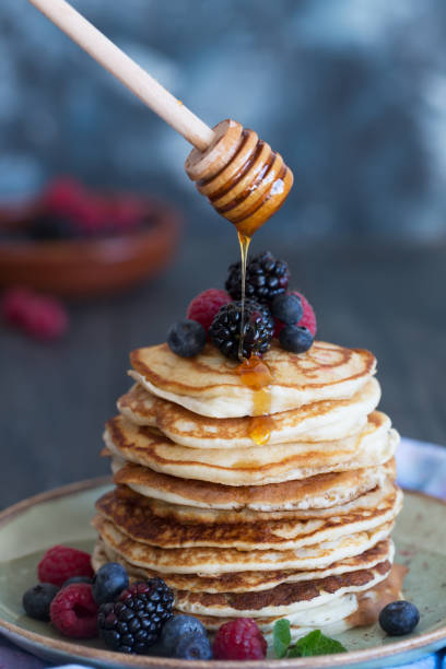 istock Pancakes with berries and honey 905897484