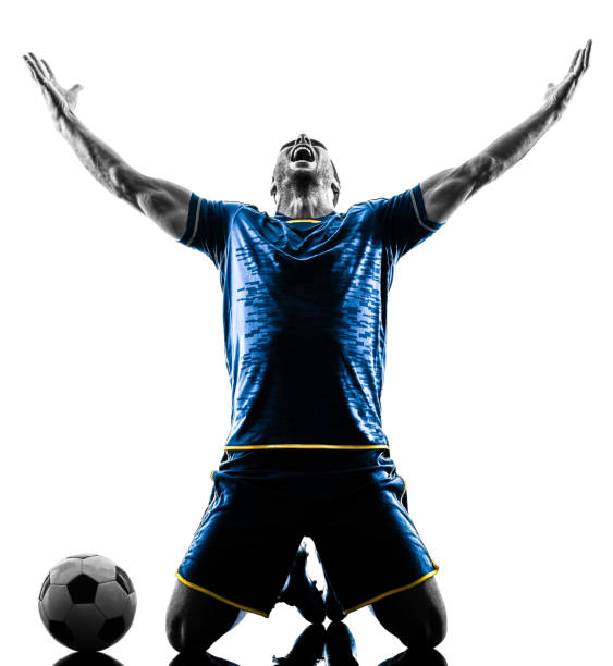 soccer player man happy celebration silhouette isolated stock photo