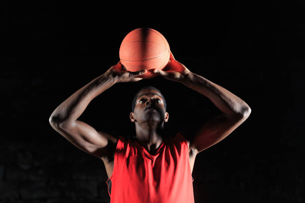 istock Basketball players playing outdoors on court 905898954