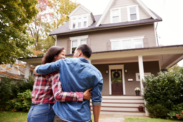 Rear View Of Loving Couple Walking Towards House Rear View Of Loving Couple Walking Towards House outdoors stock pictures, royalty-free photos & images