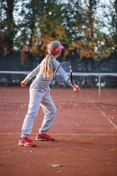 istock An active little girl, is playing tennis. 905902570