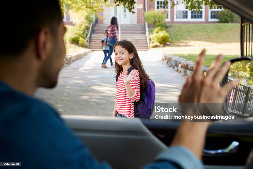 Father In Car Dropping Off Daughter In Front Of School Gates School Building Stock Photo