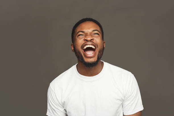 istock Facial expression, emotions, friendly black man laughing 905910386