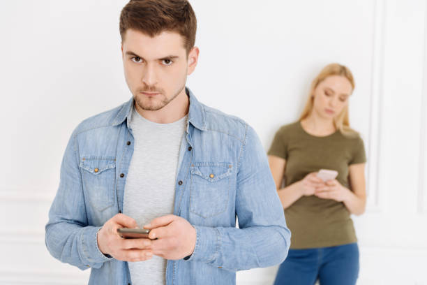 istock Serious brunette male looking at camera 905914806