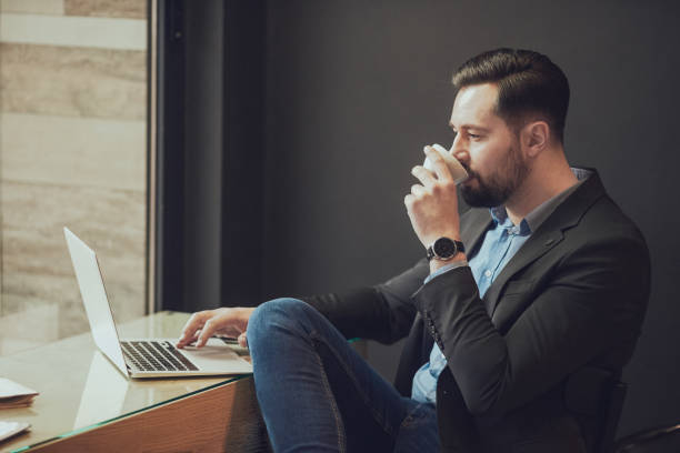 istock Businessman sitting in cafe. 905918062