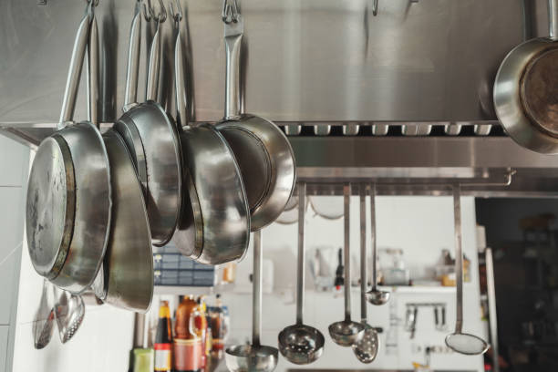istock Modern restaurant kitchen interior with frying pans 905918326