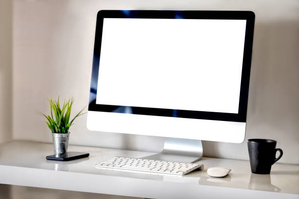 istock Modern clean workspace mockup with blank screen desktop computer and office supplies. 905920938