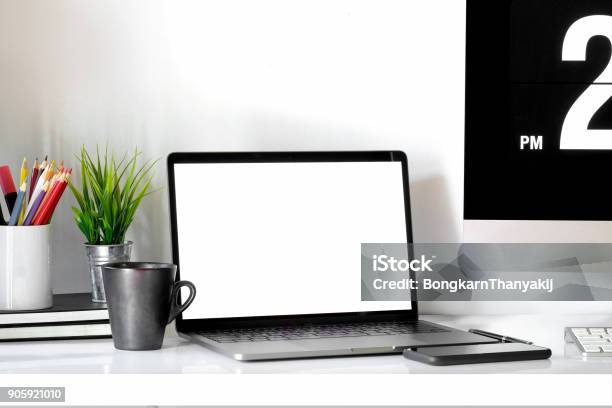 Stylish Workspace With Laptop Coffee Mug And Designer Or Office Supplies At Home Or Studio Mock Up Stock Photo - Download Image Now