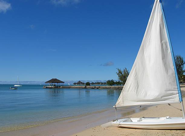 istock Tropical Resort with sailboat and pier 90592149