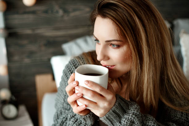 istock Cheerful woman drinking morning coffee 905921638