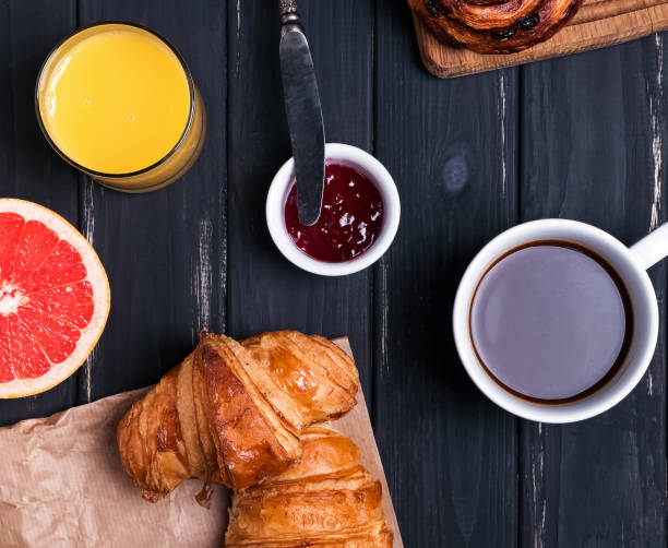 istock Delicious breakfast on the black wooden table 905922150
