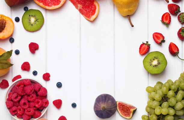 istock Fruits and berries on the white wooden background 905923242