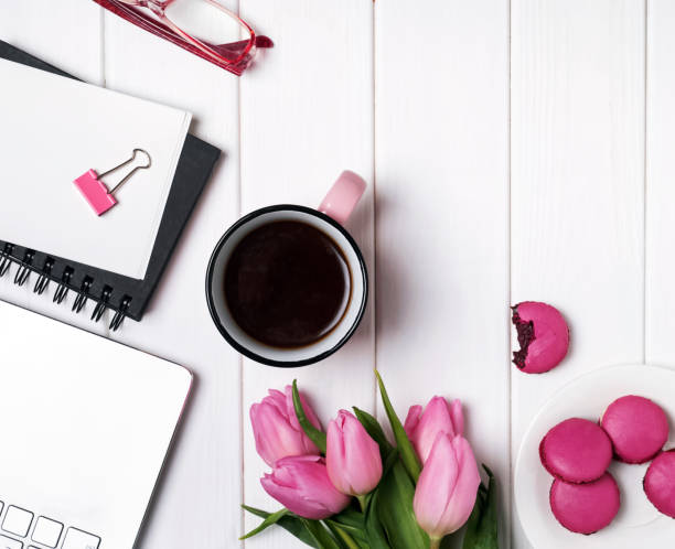 istock Pink tulips and accessories on white wooden table 905923304