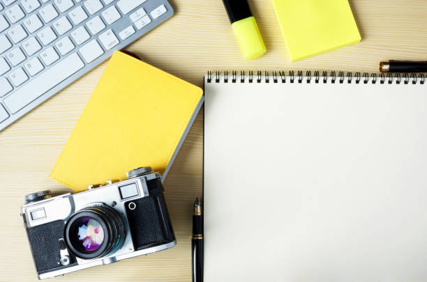 istock Open note with stickers, marker, keyboard and camera. Mock-up photo. 905926438