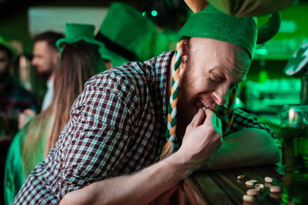 istock The man is trying to crack the nut. 905926920