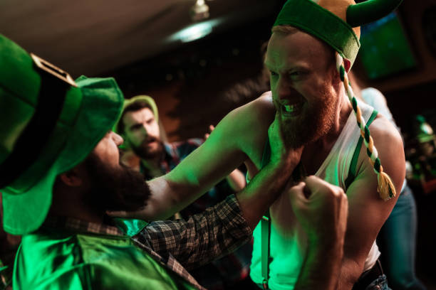 istock Two men fight in a bar. 905927356