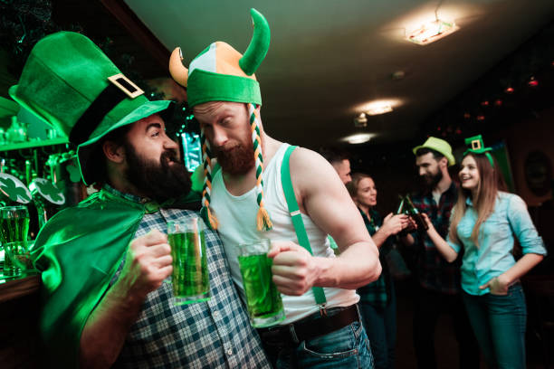 istock Two men are drinking beer in a bar. 905927388