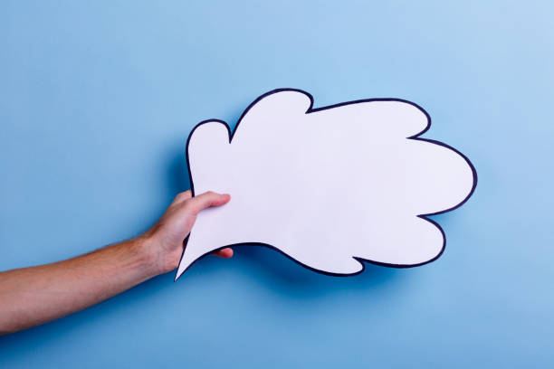 istock Man's hand holds a white icon for an idea or thought. 905932464