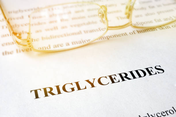 istock Page with word triglycerides and glasses. 905932558