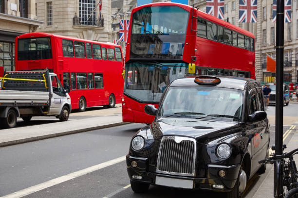 london bus and taxi regent street w1 - urban scene regent street city of westminster inner london imagens e fotografias de stock