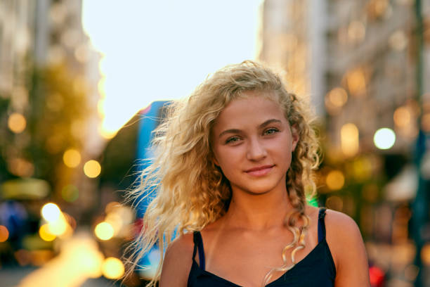Cropped portrait of an attractive young woman walking through the city