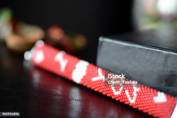 Red Beaded I Love You Bracelet On A Dark Background Close Up Stock Photo - Download Image Now