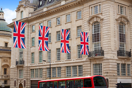 London Bus and UK flags in Piccadilly Circus England