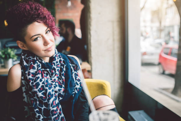 istock Short haired girl in cafe 905937416