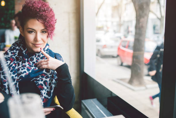 istock Short haired girl in cafe 905937506
