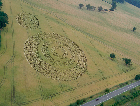An aerial shot of two crop circles in a field of corn (faked in Photoshop).

*

For more of my paranormal style photographic images check these out:

[url=http://www.istockphoto.com/file_closeup.php?id=333762][img]http://www.istockphoto.com/file_thumbview_approve.php?size=1&id=333762&refnum=georgethefourth[/img] [/url] [url=http://www.istockphoto.com/file_closeup.php?id=430249][img]http://www.istockphoto.com/file_thumbview_approve.php?size=1&id=430249[/img][/url] [url=http://www.istockphoto.com/file_closeup.php?id=456031][img]http://www.istockphoto.com/file_thumbview_approve.php?size=1&id=456031[/img][/url] [url=http://www.istockphoto.com/file_closeup.php?id=393275][img]http://www.istockphoto.com/file_thumbview_approve.php?size=1&id=393275[/img][/url] [url=http://www.istockphoto.com/file_closeup.php?id=389723][img]http://www.istockphoto.com/file_thumbview_approve.php?size=1&id=389723[/img][/url]

For more of my 3D CGI illustrations check these out:

[url=http://www.istockphoto.com/file_closeup.php?id=191045][img]http://www.istockphoto.com/file_thumbview_approve.php?size=1&id=191045[/img][/url] [url=http://www.istockphoto.com/file_closeup.php?id=393292][img]http://www.istockphoto.com/file_thumbview_approve.php?size=1&id=393292[/img][/url] [url=http://www.istockphoto.com/file_closeup.php?id=191049][img]http://www.istockphoto.com/file_thumbview_approve.php?size=1&id=191049[/img][/url] [url=http://www.istockphoto.com/file_closeup.php?id=191041][img]http://www.istockphoto.com/file_thumbview_approve.php?size=1&id=191041[/img][/url] [url=http://www.istockphoto.com/file_closeup.php?id=219225][img]http://www.istockphoto.com/file_thumbview_approve.php?size=1&id=219225[/img][/url] [url=http://www.istockphoto.com/file_closeup.php?id=333764][img]http://www.istockphoto.com/file_thumbview_approve.php?size=1&id=333764[/img][/url]
