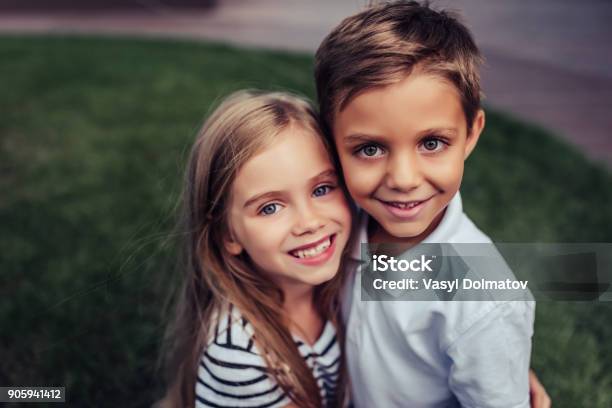 Children On Green Grass Stock Photo - Download Image Now - Child, Girls, Boys