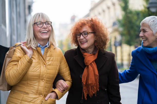 istock Three mature women out in shopping 905945000