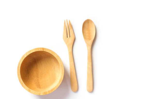 istock Wooden spoon and fork with wooden bowl. 905945186