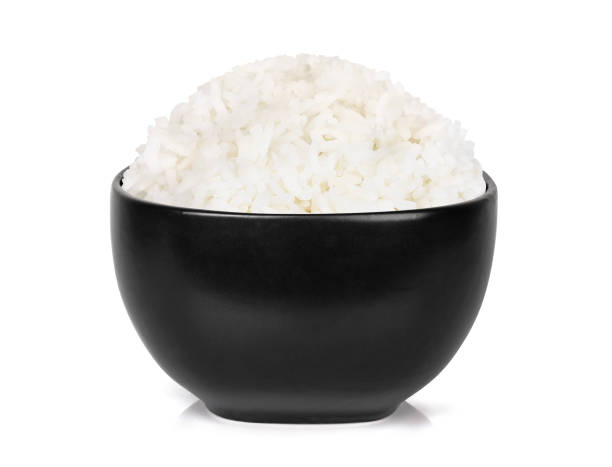istock rice in the black bowl isolated on white background 905945618