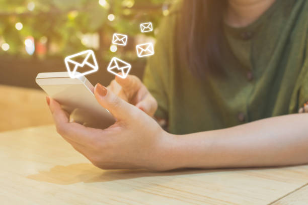 istock Woman hand using mobile phone with e-mail application, Concept email marketing and newsletter 905948156