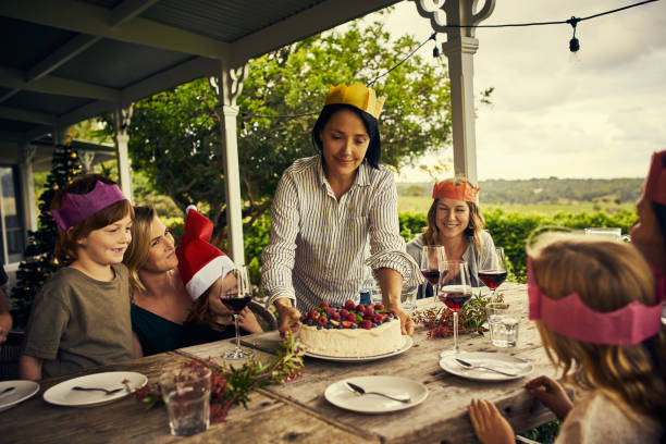 It's not a meal without a good dessert Cropped shot of a happy family having dessert together on Christmas australia photos stock pictures, royalty-free photos & images