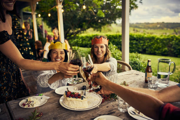 May we have many more together! Cropped shot of a group of people making a toast while having dessert traditionally australian stock pictures, royalty-free photos & images