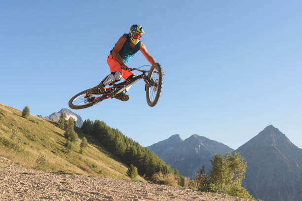 istock Man jumping in midair with mountain bike 905948626
