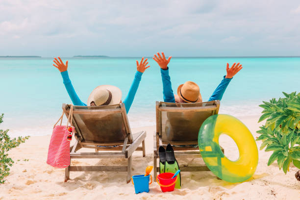 istock happy couple relax on a tropical beach 905949390