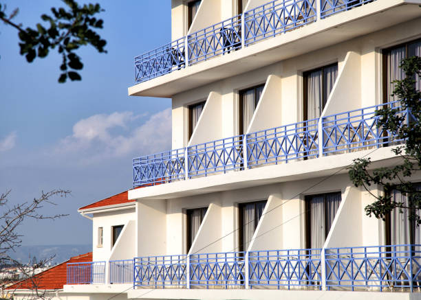 istock White modern hotel building with blue balconies 905953770