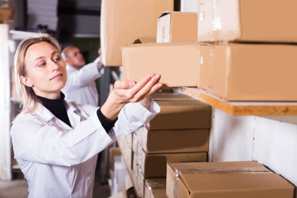 istock Couple transporting cart cardboard cases 905956442