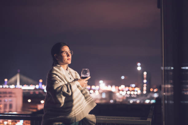 istock Woman on the balcony at night 905961706
