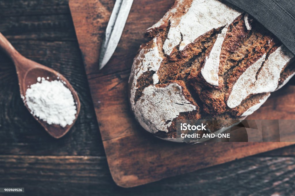 Delicious fresh bread on wooden background Delicious freshly baked bread on wooden background Bread Stock Photo