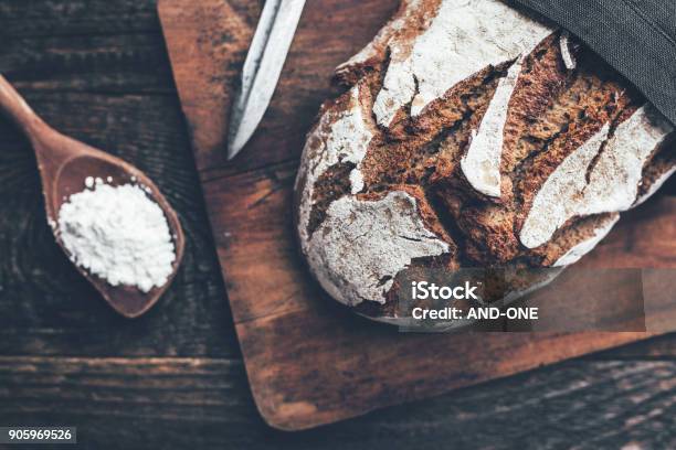 Delicious Fresh Bread On Wooden Background Stock Photo - Download Image Now - Bread, Loaf of Bread, Baguette