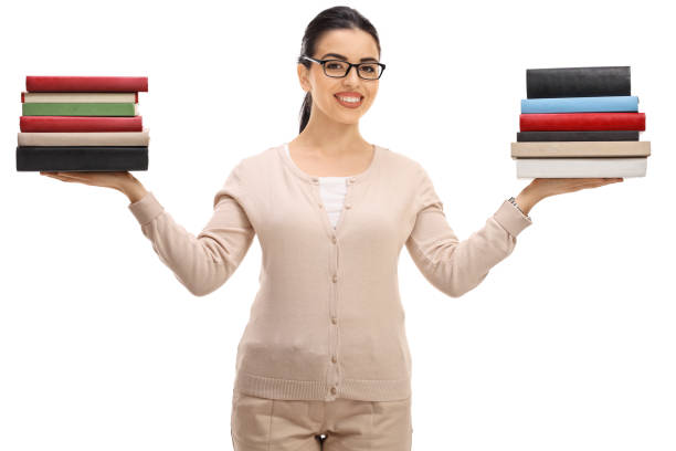 istock Female teacher with book stacks 905969928